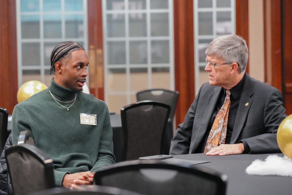 Graduating Marketing Intern Duvonte’ Beard talks with Dr. Jim Spain, Vice Provost for Undergraduate Studies during Salute to Excellence.
