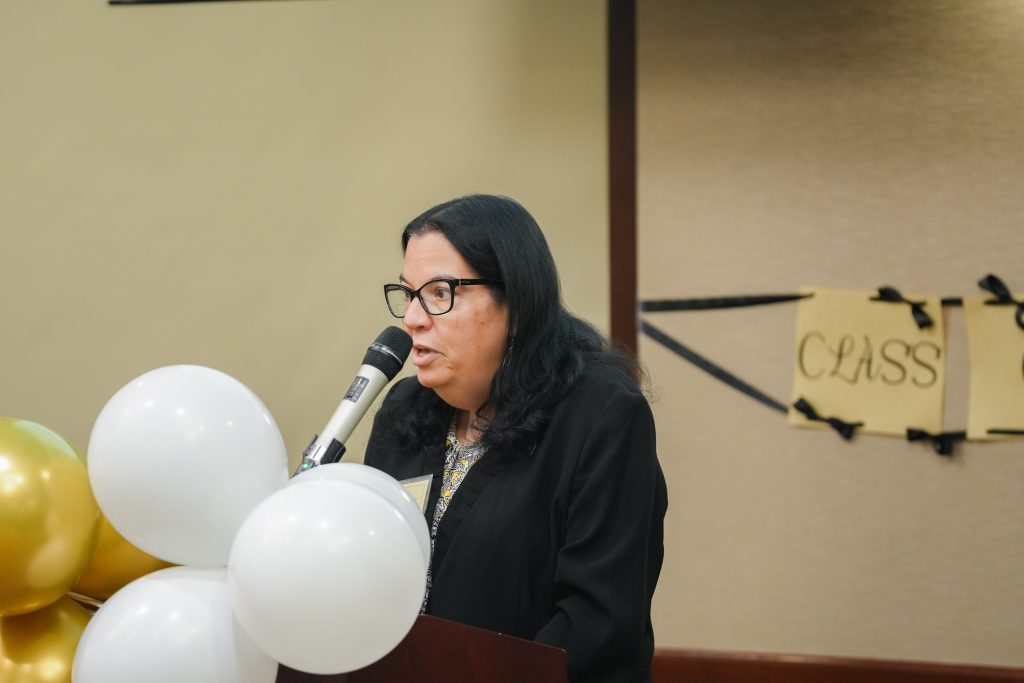 CASE Student Coordinator Ana-Maria Fernandez speaks to graduating CASE and TRiO scholars as the Salute to Excellence ceremony begins.