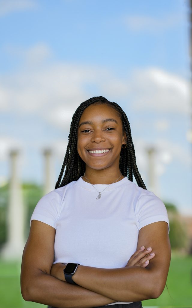 Brooks Scholar and CASE Marketing Team Lead Janae Taylor stands in front of Jesse Hall for her headshot photos.