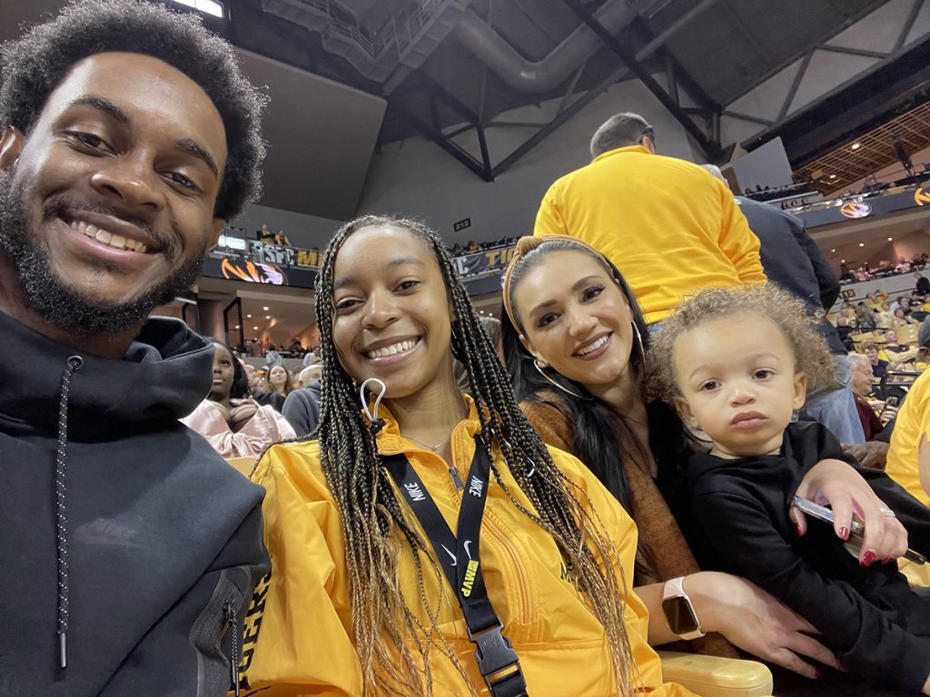 Janae, previous CASE Marketing Intern, DuVonte’ Beard, previous CASE Marketing Director, Fallon Smith, and her son, all smile for a group selfie at the Mizzou vs. Georgia basketball game in the Mizzou Arena on March 5, 2022.