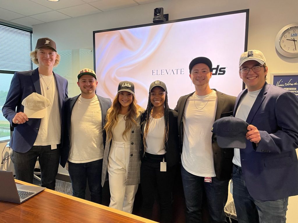 Janae and her internship group present their hat concept to the Senior Leadership Team of Lids at headquarters on July 27, 2022.
