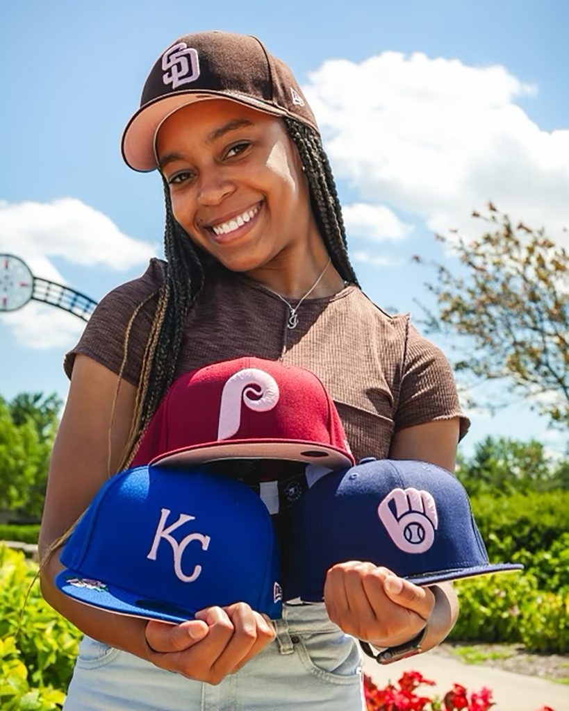 Janae shows off Lids’ new Roses hat collection for an internship photo shoot on July 12, 2022.