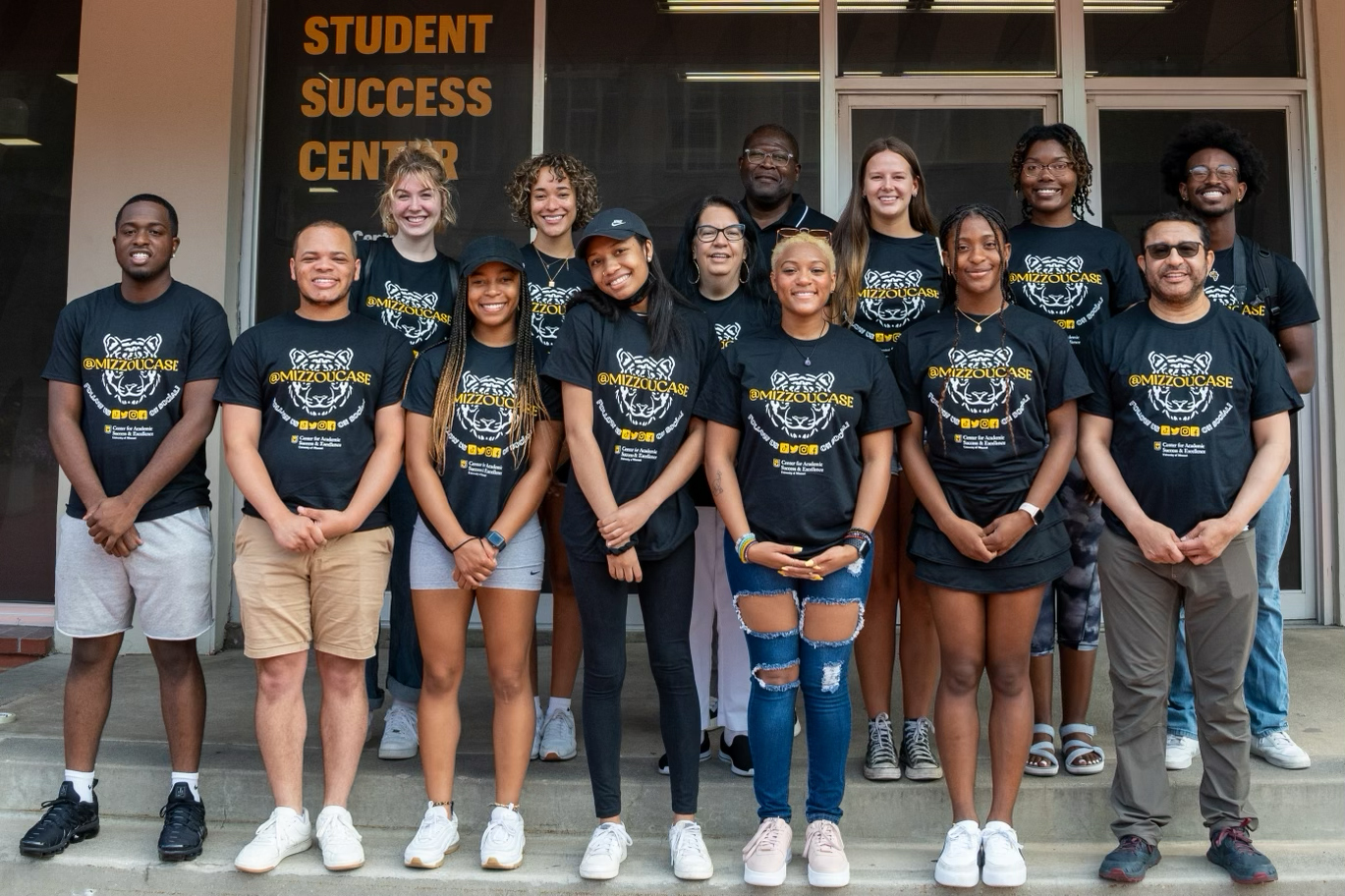 Group of CASE scholars on the steps of the Student Success Center.