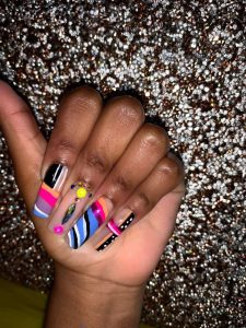 Bonner started doing nails, including on herself, with this patterned and jeweled set as one of her first in her career back in 2020. (Photo/Aireeyce Bonner)