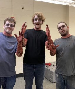 Three students get into character for the camera after getting zombie makeup looks for their shooting of 'Tomb of the Dead' on March 15, 2023. (Photo/Alana Hayes)