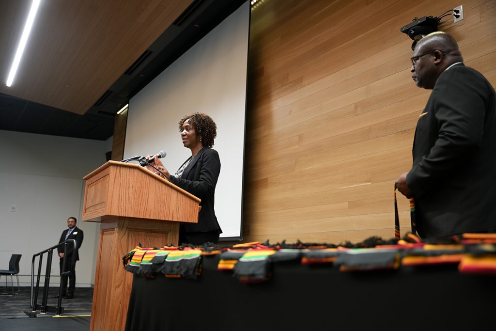 CASE Student Services Coordinator LeAnn Stroupe instructs graduating CASE scholars on what to say on the stage before receiving their Kente Stoles at the ceremony on April 27, 2023. (CASE photos/Braiden Wade)