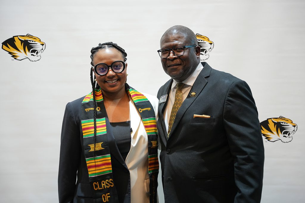 CASE Director Dr. Andre Thorn and Kamara Jones, Acting Assistant Secretary for Public Affairs at the US Department of Health and Human Services, come together for a picture in front of a MU themed step and repeat at the ceremony on April 27, 2023. (CASE photos/Braiden Wade)